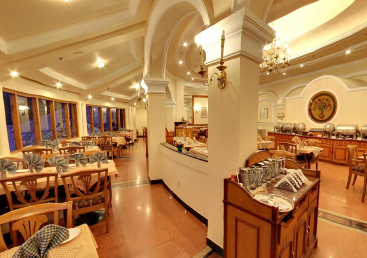 Tea County Hotel Мунар Екстериор снимка